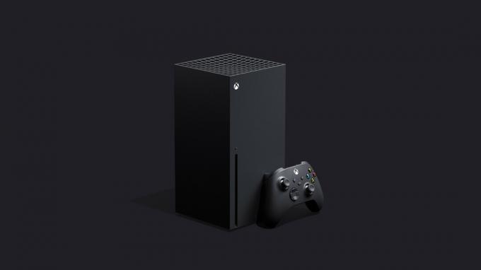 黒の背景にマットブラックの Xbox Series X とコントローラー。 