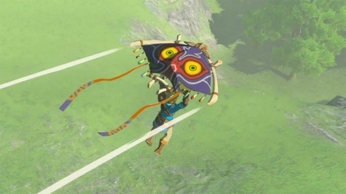Link se desliza con un planeador temático de Majora's Mask en Tears of the Kingdom.