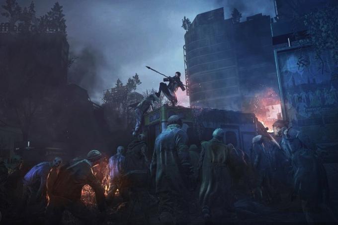 Seorang karakter melihat ke bawah ke arah gerombolan mayat hidup di Dying Light 2.