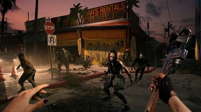 Posnetek zaslona igre Dead Island 2 z zombiji, ki obdajajo osebo lika.