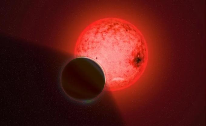 Umjetnikova koncepcija velikog plinovitog divovskog planeta koji kruži oko male zvijezde crvenog patuljka nazvane TOI-5205.