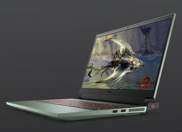 Dell G15-Gaming-Laptop mit PC-Videospielszene auf dem Bildschirm eines Drachens auf grauem Hintergrund