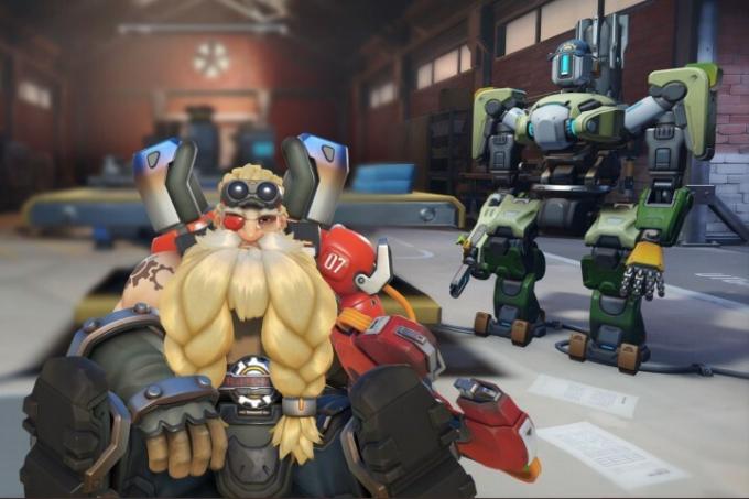 Bastion และ Torbjorn นั่งอยู่ในเวิร์กช็อปใน Overwatch 2