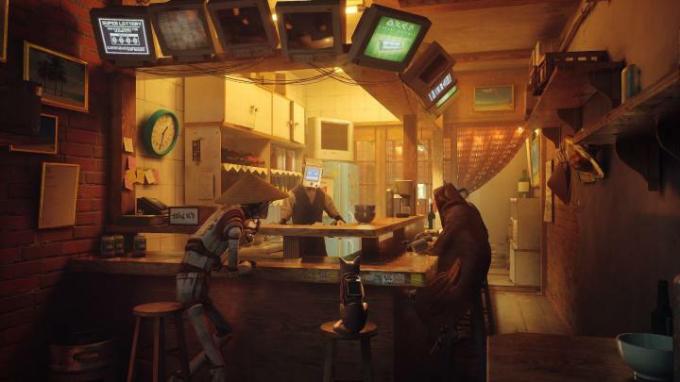 En katt sitter på en bar med androider i Stray.