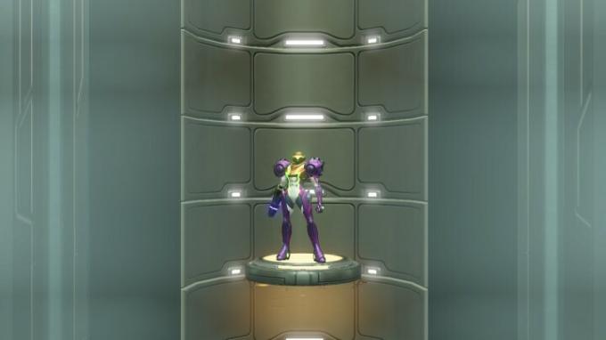 Samus utilise un ascenseur dans Metroid Dread.