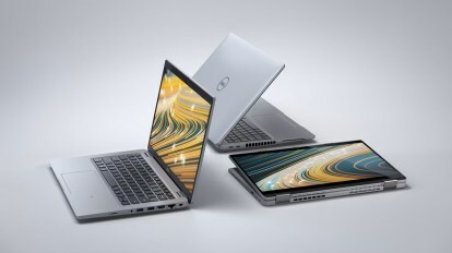 Laptop Dell ditata dengan latar belakang gradien.