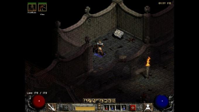 Diablo II: n sivuhuone, jossa on kourallinen kynttilöitä.