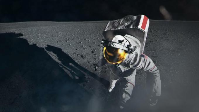 Ilustracja artystyczna przedstawiająca astronautę Artemidy wychodzącego z lądownika księżycowego na powierzchnię Księżyca.