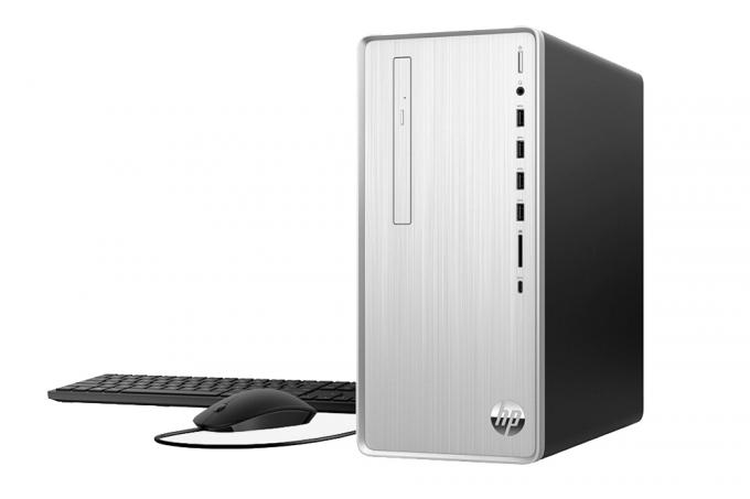 O desktop HP Pavilion com teclado e mouse.