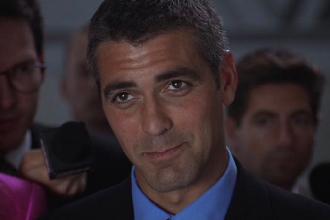 George'as Clooney šypsosi kaip Bruce'as Wayne'as filme Betmenas ir Robinas.