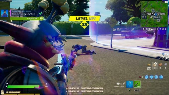 Fortnite'ta kafasında uzaylı parazit varken NPC'ye ateş etmek.