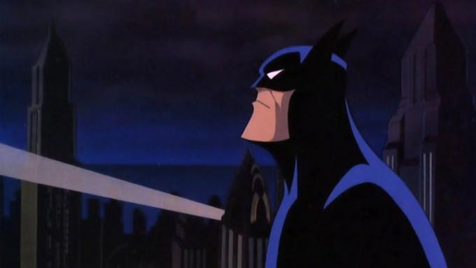 Batman felnéz a denevér-jelre Gotham Cityben.