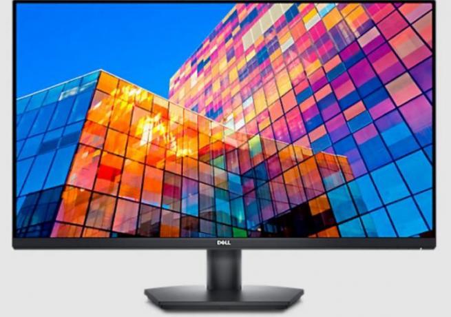 Dell 32-palčni monitor prikazuje barvito stavbo.