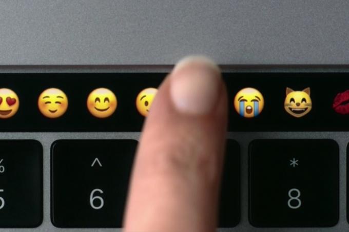 O TouchBar exibindo emojis. 