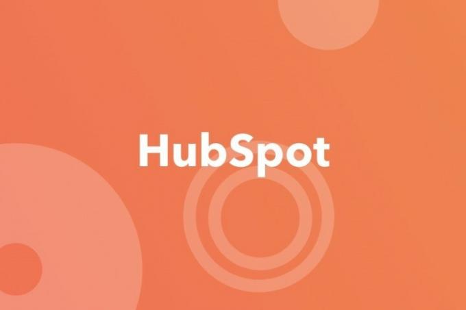 HubSpot logotips uz oranža fona.