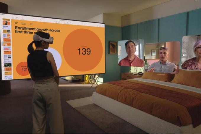En person som använder ett Apple Vision Pro-headset för att ha ett FaceTime-videosamtal med flera personer.