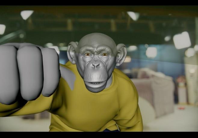 『ノープ』の VFX シーンでテーブルの下で覗き込む CG のチンパンジーのゴーディ。