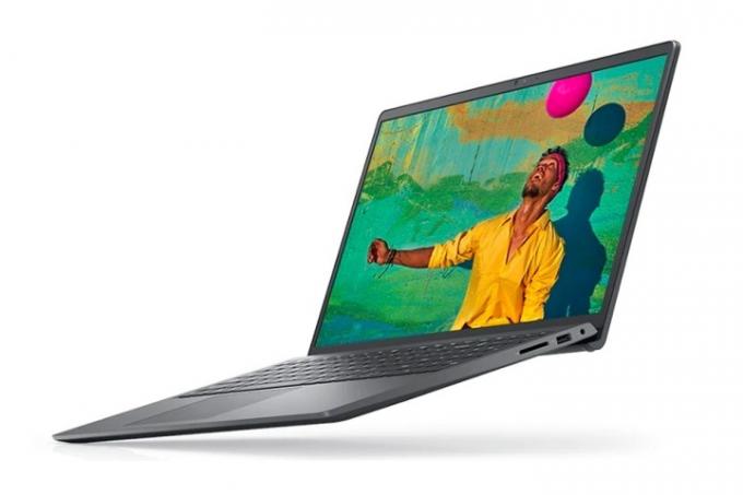 Dell Inspiron 15 3000 laptop fehér alapon, színes jelenettel.