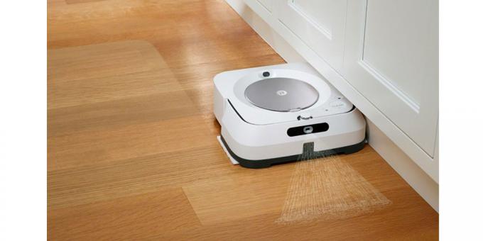 O robô esfregão iRobot Braava jet m6 em um piso de madeira dura.