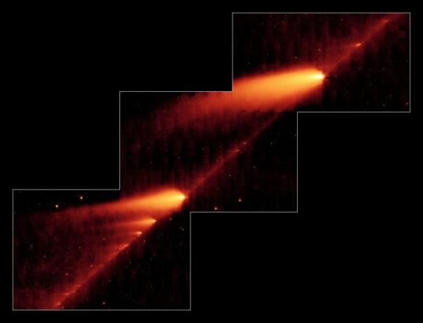 Powyższe zdjęcie w podczerwieni wykonane przez należący do NASA Kosmiczny Teleskop Spitzera pokazuje uszkodzoną kometę 73PSchwassman-Wachmann 3 przesuwającą się po śladzie szczątków pozostawionych podczas wielokrotnych podróży dookoła Słońca. Obiekty przypominające płomienie to fragmenty komety i jej ogony, natomiast zakurzony ślad komety to linia łącząca fragmenty.