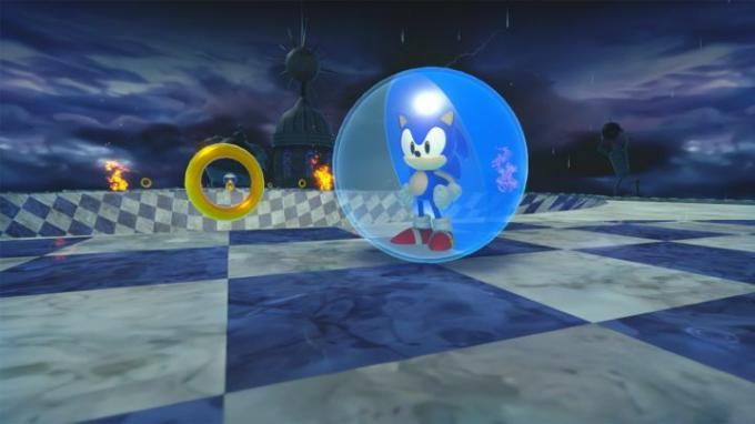 Sonic se tient triomphalement à côté de quelques anneaux du monde Storm.